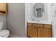 Cozy half bath featuring a sink and vanity cabinet at 4305 Heathgate Ln, Raleigh, NC 27613