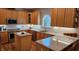Well-lit kitchen featuring custom cabinets, granite countertops, and stainless steel appliances at 4305 Heathgate Ln, Raleigh, NC 27613
