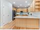 Spacious kitchen with island, stainless steel appliances, granite countertops, and wooden cabinets at 4305 Heathgate Ln, Raleigh, NC 27613