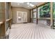 Spacious screened porch with skylights and access to backyard, great for entertaining at 4305 Heathgate Ln, Raleigh, NC 27613