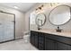 Modern bathroom features double vanity, granite countertops, and tiled walk-in shower at 4924 Zebulon Rd, Zebulon, NC 27597