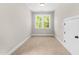 Cozy room features carpet flooring, natural light, and closet at 4924 Zebulon Rd, Zebulon, NC 27597