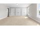 Bright bedroom with carpeted floor, natural light, and convenient access to closet storage at 4924 Zebulon Rd, Zebulon, NC 27597
