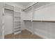 Spacious walk-in closet with wooden rods and shelving system provides ample storage at 4924 Zebulon Rd, Zebulon, NC 27597