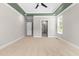 Spacious bedroom with recessed lighting, neutral walls, and doorway to the on-suite bathroom at 4924 Zebulon Rd, Zebulon, NC 27597