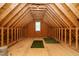Unfinished attic space with wood beams and flooring provides versatile potential at 5305 Yorkville Ct, Holly Springs, NC 27540