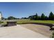 Spacious backyard features a hot tub, brick patio, and lush green lawn at 5305 Yorkville Ct, Holly Springs, NC 27540