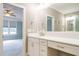 Bathroom with white vanity, quartz countertop, and elegant fixtures leading to a bedroom at 5305 Yorkville Ct, Holly Springs, NC 27540