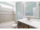Beautiful bathroom featuring a framed mirror, tile accents, shower and modern vanity at 5305 Yorkville Ct, Holly Springs, NC 27540