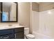 Bathroom featuring dark cabinets, a full bath, and modern fixtures at 5305 Yorkville Ct, Holly Springs, NC 27540