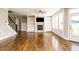 Inviting living area with a cozy fireplace, custom built-ins and hardwoods at 5305 Yorkville Ct, Holly Springs, NC 27540