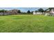 Expansive backyard features green grass, a storage shed, and play equipment at 5400 Falconton Ln, Raleigh, NC 27610