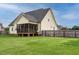 Exterior view of home and screened porch from the backyard at 5400 Falconton Ln, Raleigh, NC 27610