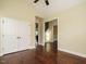 Bedroom showcasing hardwood floors and a closet at 5400 Falconton Ln, Raleigh, NC 27610