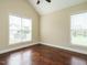 Bright bedroom with hardwood floors and natural light at 5400 Falconton Ln, Raleigh, NC 27610