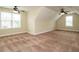 Spacious bedroom featuring carpet, ample natural light, and ceiling fans at 5400 Falconton Ln, Raleigh, NC 27610