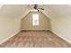 A cozy bedroom with neutral walls, plush carpet, and a bright window at 5400 Falconton Ln, Raleigh, NC 27610