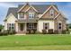 Charming two-story home with a well-maintained lawn and inviting curb appeal at 5400 Falconton Ln, Raleigh, NC 27610