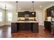 Spacious kitchen island with bar seating at 5400 Falconton Ln, Raleigh, NC 27610