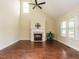 Open living room with high ceilings, fireplace, and hard wood floors at 5400 Falconton Ln, Raleigh, NC 27610