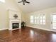 This living room features hard wood floors, large windows, and high ceilings at 5400 Falconton Ln, Raleigh, NC 27610