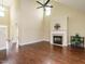 Open living room with high ceilings, fireplace, and hard wood floors at 5400 Falconton Ln, Raleigh, NC 27610
