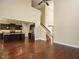 Open concept living room space adjacent to kitchen, entryway, and stairs at 5400 Falconton Ln, Raleigh, NC 27610