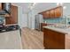 Well-equipped kitchen with stainless steel appliances, wood cabinetry, and ample counter space at 5561 Roan Mountain Pl, Raleigh, NC 27613