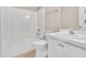 Bathroom features tub-shower combo, vanity, mirror, toilet and neutral decor at 5617 Tealbrook Dr, Raleigh, NC 27610
