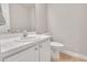 Half bath features a vanity, mirror, toilet and neutral decor at 5617 Tealbrook Dr, Raleigh, NC 27610
