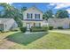 Charming two-story home with black shutters and a well-manicured lawn at 5617 Tealbrook Dr, Raleigh, NC 27610
