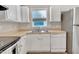 Functional kitchen featuring white cabinetry and stainless steel appliances, creating a bright and efficient cooking area at 5617 Tealbrook Dr, Raleigh, NC 27610