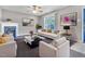 Staged living room with fireplace, neutral walls, large window and lots of light at 5617 Tealbrook Dr, Raleigh, NC 27610