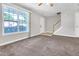 Living room with staircase and large window at 5617 Tealbrook Dr, Raleigh, NC 27610