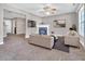 Staged living room with fireplace, neutral walls and ample natural light at 5617 Tealbrook Dr, Raleigh, NC 27610