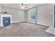 Living room featuring a fireplace, neutral walls and ample natural light at 5617 Tealbrook Dr, Raleigh, NC 27610