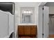 Bathroom features a vanity with marble countertop and saloon doors for the shower at 5918 Efland Cedar Grove Rd, Cedar Grove, NC 27231