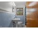 Bathroom with bead board paneling, updated vanity, and tiled floors at 5918 Efland Cedar Grove Rd, Cedar Grove, NC 27231