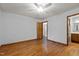Bedroom with hardwood floors and access to the bathroom at 5918 Efland Cedar Grove Rd, Cedar Grove, NC 27231