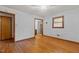Bedroom with hardwood floors and access to the bathroom and closet at 5918 Efland Cedar Grove Rd, Cedar Grove, NC 27231