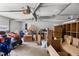 Garage interior with riding lawn mower and storage boxes at 5918 Efland Cedar Grove Rd, Cedar Grove, NC 27231
