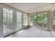 Sunroom features large windows and glass doors leading to the outside at 5918 Efland Cedar Grove Rd, Cedar Grove, NC 27231