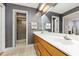 Well-lit bathroom with double vanity, neutral tile, and modern fixtures at 6 Womble Cir, Durham, NC 27705