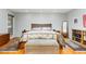 Relaxing bedroom features hardwood floors, a comfortable bed, and tasteful decor at 6 Womble Cir, Durham, NC 27705