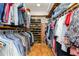Walk-in closet provides ample storage with shelves, hanging space, and shoe racks at 6 Womble Cir, Durham, NC 27705