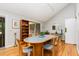 Bright dining room features hardwood floors, ample natural light, and stylish furniture at 6 Womble Cir, Durham, NC 27705