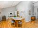Bright dining room features hardwood floors, ample natural light, and stylish furniture at 6 Womble Cir, Durham, NC 27705