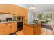 Functional kitchen featuring stainless steel appliances, a center island, and plenty of storage at 6 Womble Cir, Durham, NC 27705