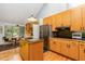 Bright kitchen with ample cabinet space, a center island, and a cozy breakfast nook at 6 Womble Cir, Durham, NC 27705