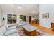 Open-concept living room with hardwood floors and large sliding glass doors leading to a patio at 6 Womble Cir, Durham, NC 27705